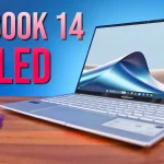 Asus Zenbook 14 OLED laptop displaying its specifications and features on screen