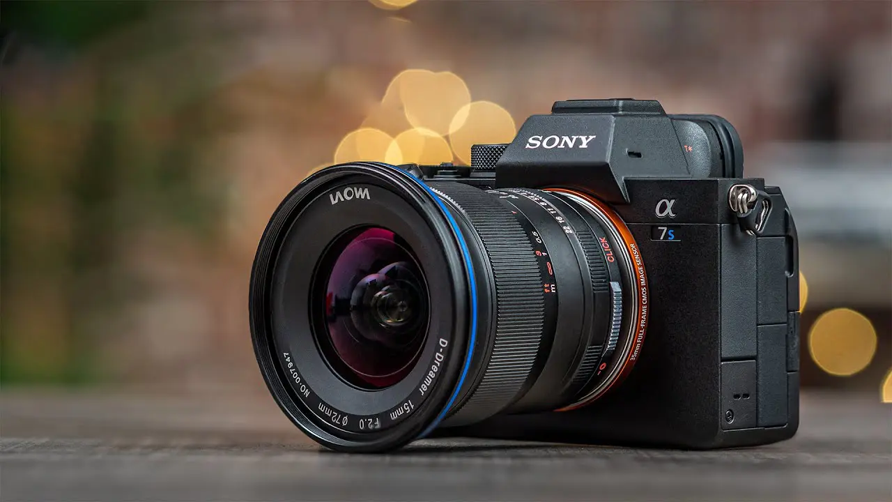Sony a7S III mirrorless camera filming a night cityscape, showcasing its low-light 4K video capabilities and flip-out touchscreen.