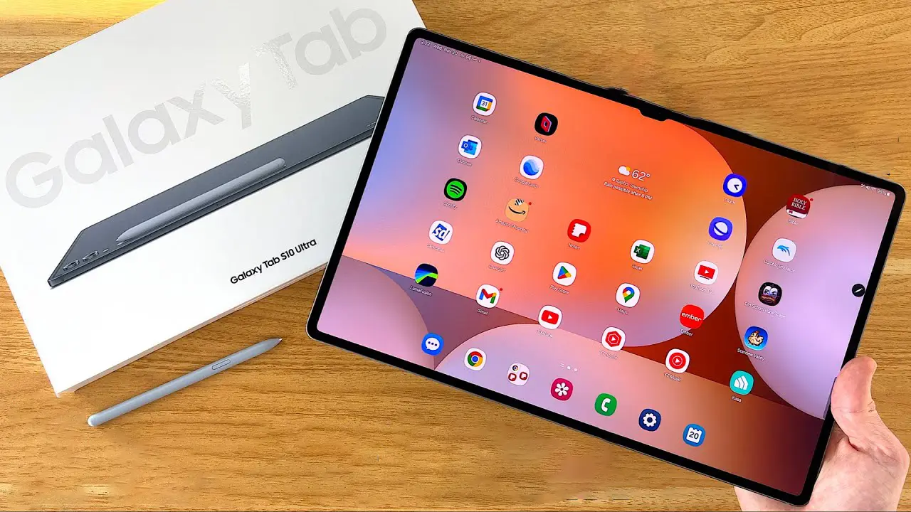 Samsung Galaxy Tab S10 Ultra tablet held in hand, showcasing its ultra-slim design, vibrant display, and multitasking capabilities with stylus and keyboard accessories.