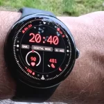 Google Pixel Watch 3 45mm in Matte Black on a wrist, showing the larger circular OLED display and sleek stainless steel design