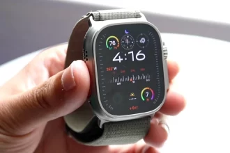 Close-up of Apple Watch Ultra 2 displaying real-time ECG and blood oxygen readings on 1.92-inch Retina display.