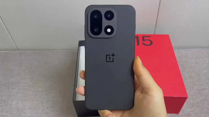 The new OnePlus 15 smartphone showing its flat display and triple camera module.
